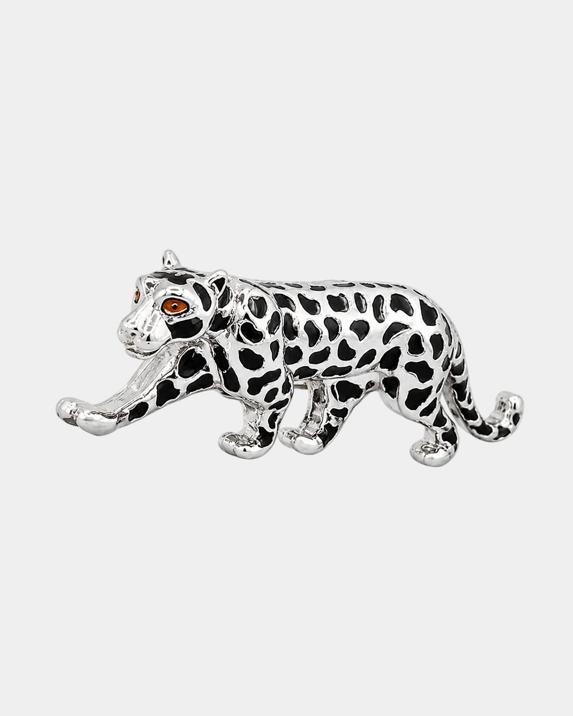 Silver leopard brooch with black spots on a white background