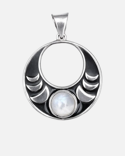 Silver pendant with moon phases and pearl on a white background
